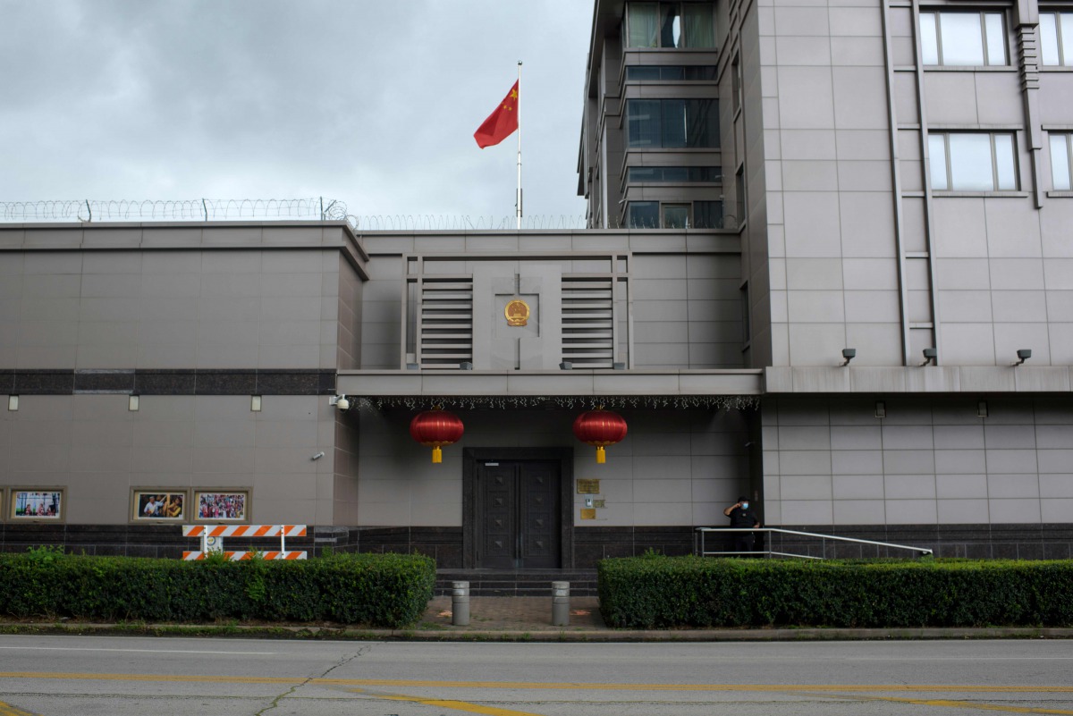 The Chinese flag flies outside of the Chinese consulate in Houston after the US State Department ordered China to close the consulate in Houston, Texas, July 22, 2020. / AFP / AFP / Mark Felix
