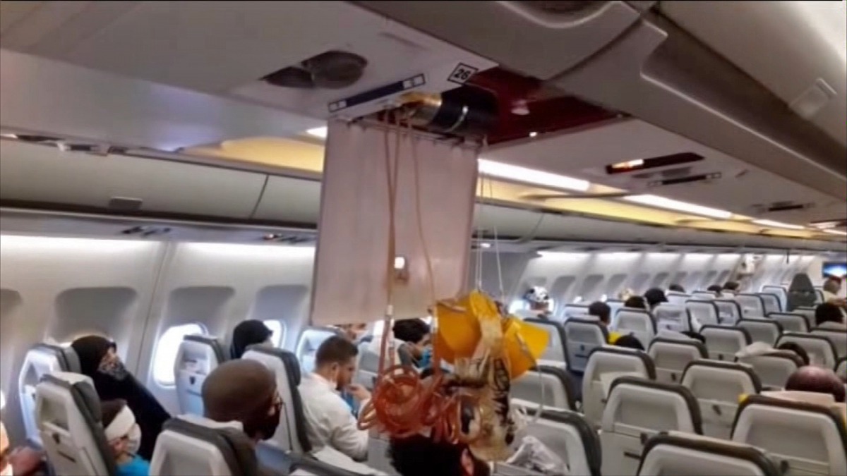 An image grab from a video released by state-run Iran Press news agency on July 24, 2020, reportedly shows released oxygen mask in the cabin of an Iranian passenger plane after it was intercepted by a US F-15 while flying over Syria.