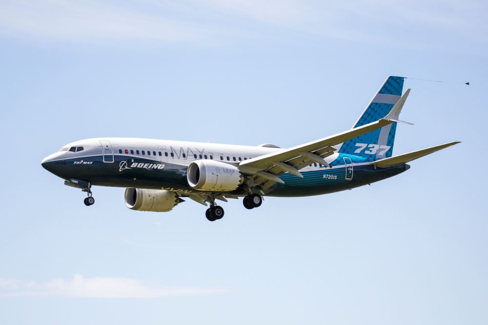 In this file photo taken on June 29, 2020 a Boeing 737 MAX jet comes in for a landing following a Federal Aviation Administration (FAA) test flight at Boeing Field in Seattle, Washington. The grounded Boeing 737 MAX moved another step closer towards flyin