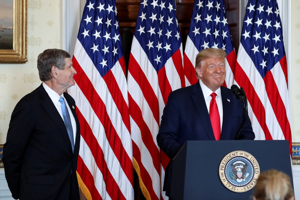 U.S. President Donald Trump speaks prior to awarding the Presidential Medal of Freedom to three-time Olympian runner and former U.S. Rep. Jim Ryun (R-KS) during a ceremony in the Blue Room at the White House in Washington, U.S., July 24, 2020. REUTERS/Lea