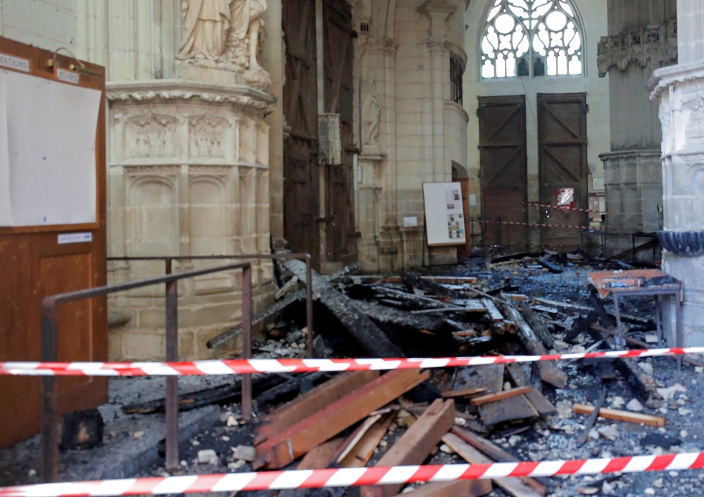 FILE PHOTO: A view of debris caused by a fire inside the Cathedral of Saint Pierre and Saint Paul in Nantes, France, July 18, 2020. REUTERS/Stephane Mahe/File Photo