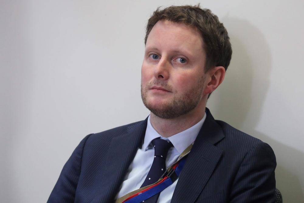 In this file photo taken on March 22, 2019 Presidential Advisor for Europe Clement Beaune listens to France's President Emmanuel Macron during a press conference at the end of an EU summit focused on Brexit in Brussels. Clement Beaune has been appointed J
