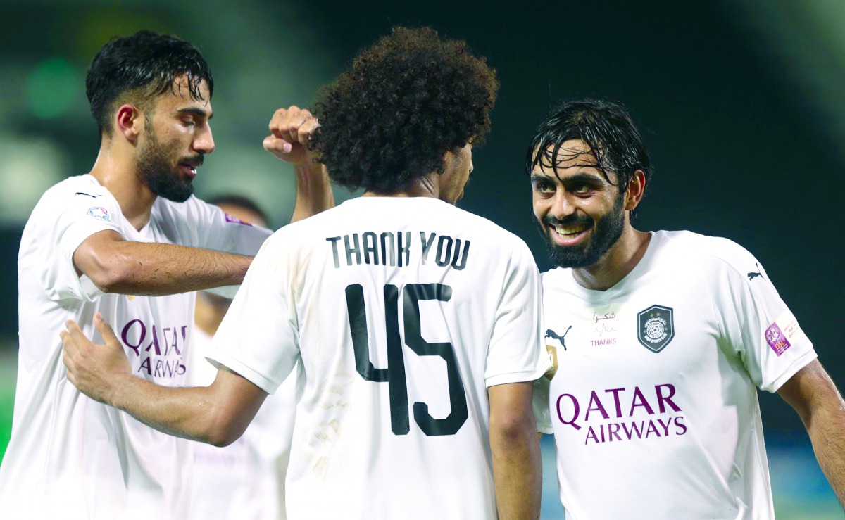 Al Sadd's Akram Afif (centre) wearing a jersey that reads 'Thank You' in honour of the efforts of healthcare workers and all those combating the pandemic during their QNB Stars league match against Al Khor on Saturday.