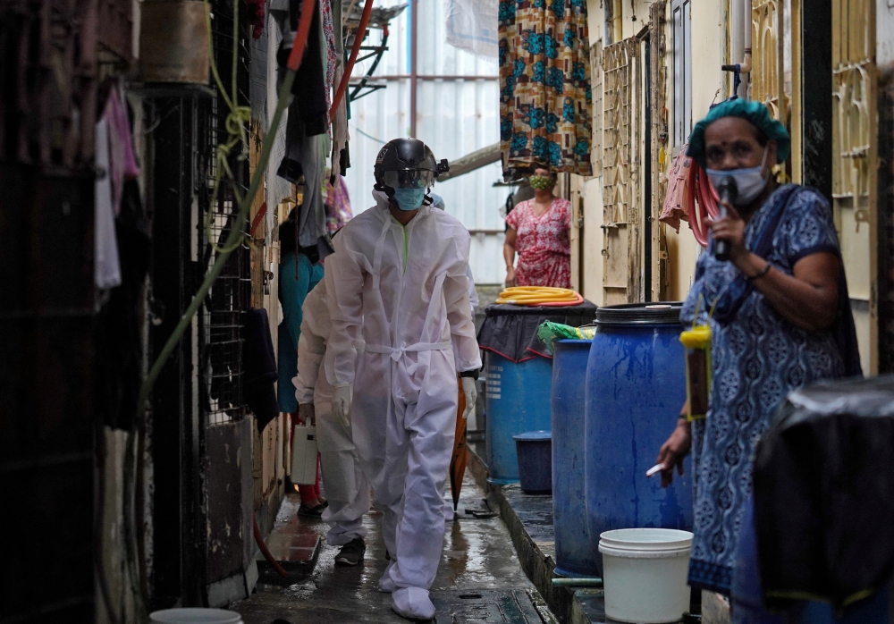 FILE PHOTO: A worker from Bharatiya Jain Sanghatana, a non-governmental organization, wearing a 