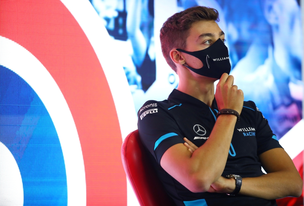 Formula One F1 - British Grand Prix - Silverstone Circuit, Silverstone, Britain - July 30, 2020 Williams' George Russell wears a face mask during a press conference ahead of the British Grand Prix FIA/Handout via REUTERS