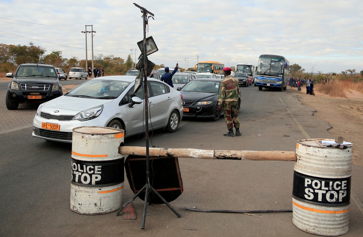 Police and soldiers check on motorists at a roadblock during the coronavirus disease (COVID-19) outbreak in Harare, Zimbabwe, July 24, 2020. REUTERS/Philimon Bulawayo