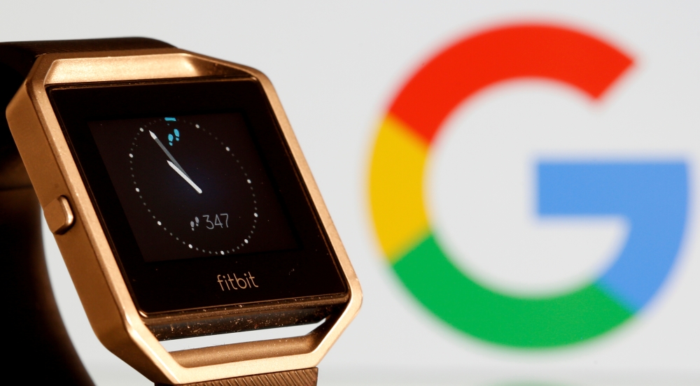 FILE PHOTO: Fitbit Blaze watch is seen in front of a displayed Google logo in this illustration picture taken, November 8, 2019. REUTERS/Dado Ruvic/File Photo