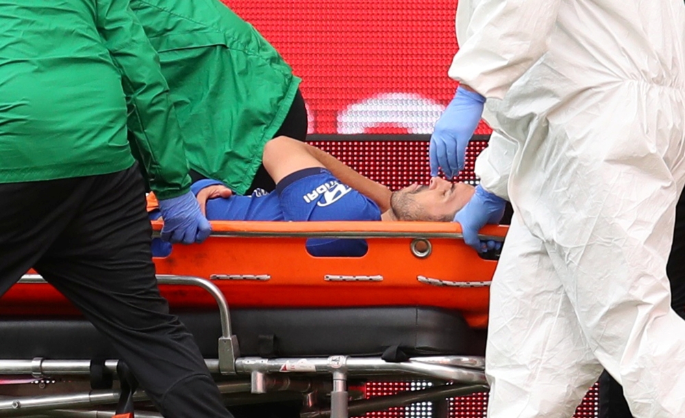 FILE PHOTO: Soccer Football - FA Cup Final - Arsenal v Chelsea - Wembley Stadium, London, Britain - August 1, 2020 Chelsea's Pedro is stretchered off after sustaining an injury, as play resumes behind closed doors following the outbreak of the coronavirus