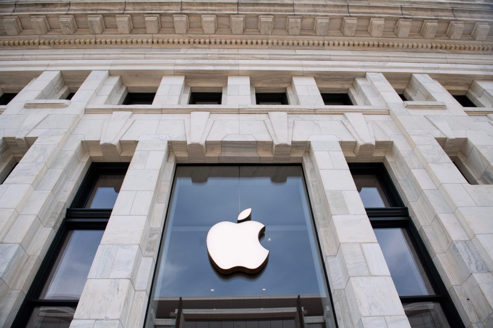 In this file photo taken on April 29, 2020 a closed Apple Store in Washington, DC, on April 29, 2020, ahead of their expected first quarter earnings report after market close. Apple on July 30, 2020, reported higher profits in the past quarter, with stron