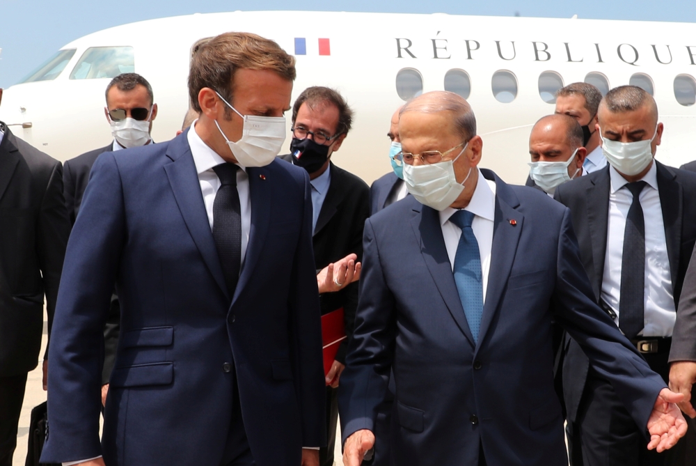 Lebanon's President Michel Aoun welcomes French President Emmanuel Macron upon his arrival at the airport in Beirut, Lebanon August 6, 2020. Dalati Nohra/Handout