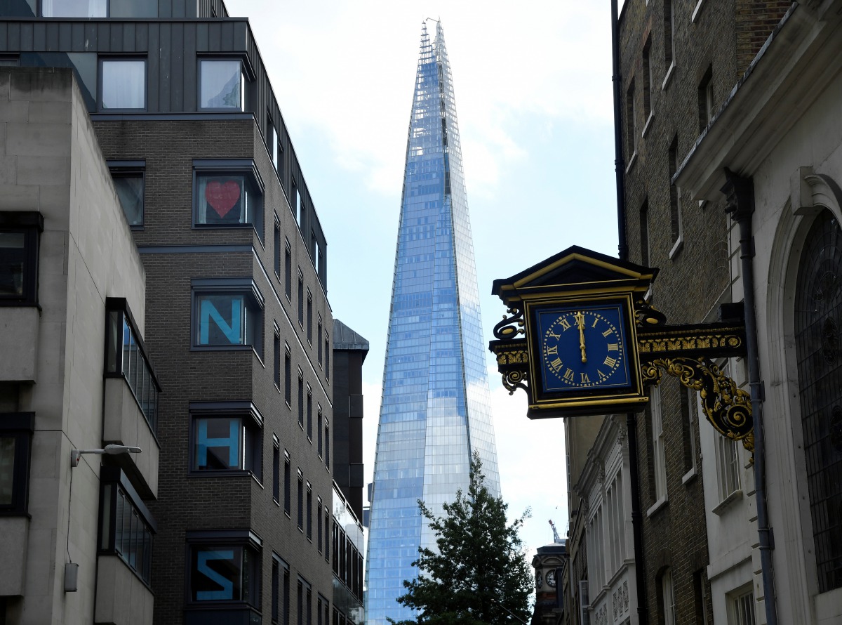 A message thanking health workers of the NHS is seen on office windows with the Shard skyscraper behind, as the outbreak of the coronavirus disease (COVID-19) continues, in London, Britain, August 6, 2020. REUTERS/Toby Melville