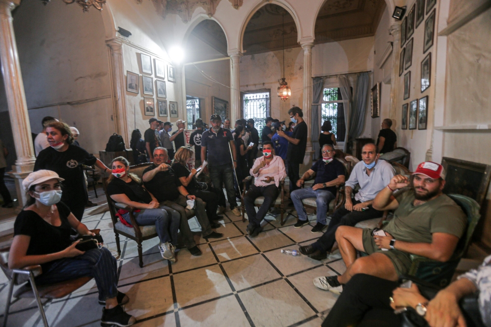 Lebanese protesters enter the Ministry of Foreign Affairs in Beirut on August 8, 2020, after they stormed the ministry as anger exploded over a deadly blast that made hundreds of thousands homeless and shocked the world. As security forces focused their a
