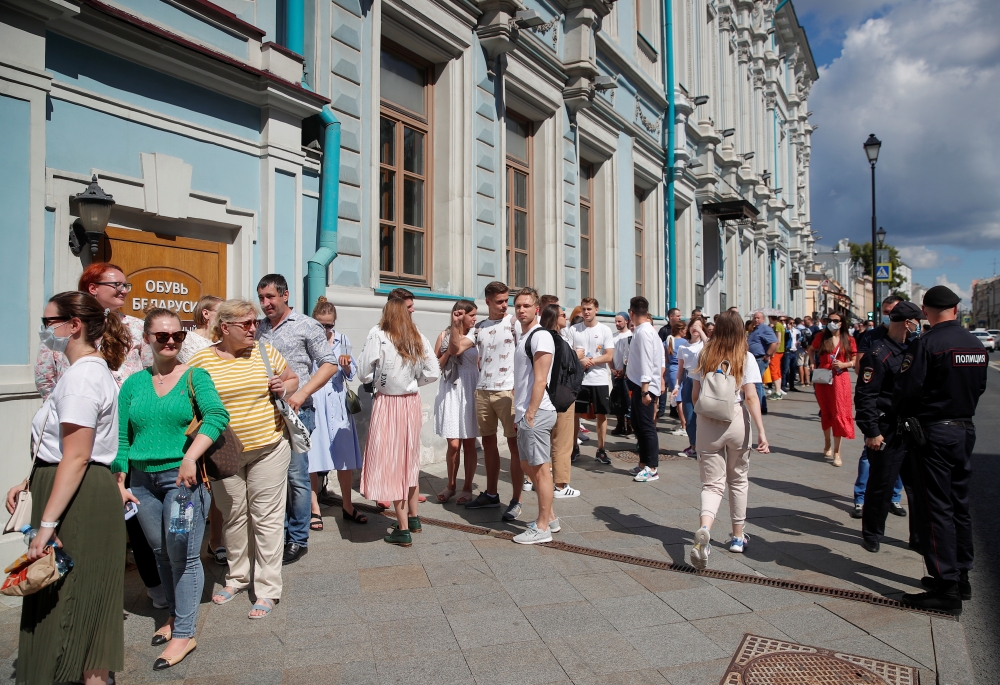 People queue outside the Belarusian embassy to cast their votes during the presidential election in Moscow, Russia August 9, 2020. REUTERS/Maxim Shemetov
