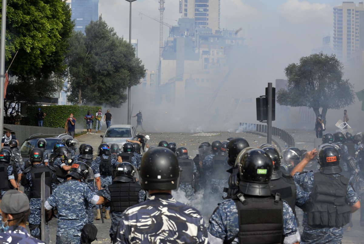 BEIRUT, LEBANON - AUGUST 08: Thousands of demonstrators clash with Lebanese riot police as riot police intervene them while they gather for a protest against government at the Martyrs' Square after the deadly explosion at the Port of Beirut led to massive