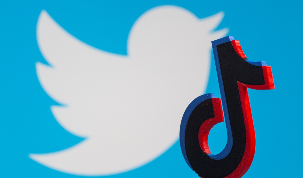 A 3D-printed Tik Tok logo is placed in front of a displayed Twitter logo in this illustration picture taken August 9, 2020. REUTERS/Dado Ruvic/Illustration
