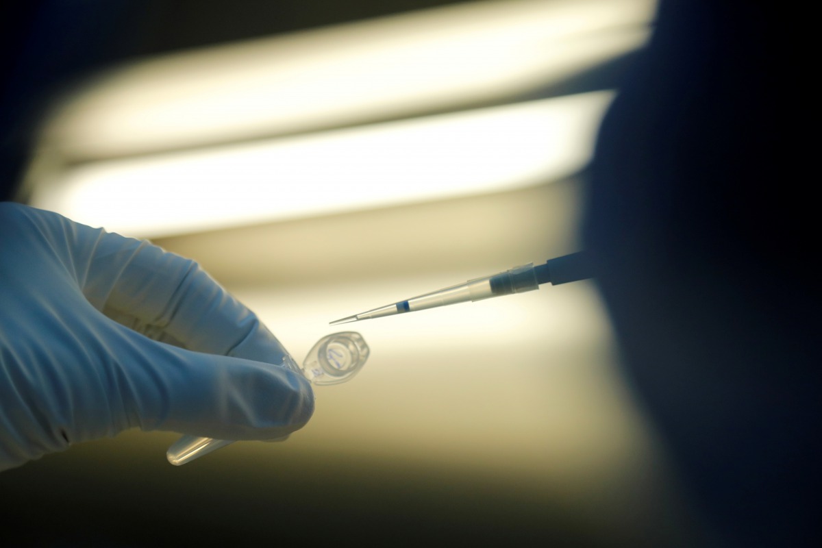 FILE PHOTO: FILE PHOTO: A scientist prepares samples during the research and development of a vaccine against the coronavirus disease (COVID-19) at a laboratory of BIOCAD biotechnology company in Saint Petersburg, Russia June 11, 2020. REUTERS/Anton Vagan