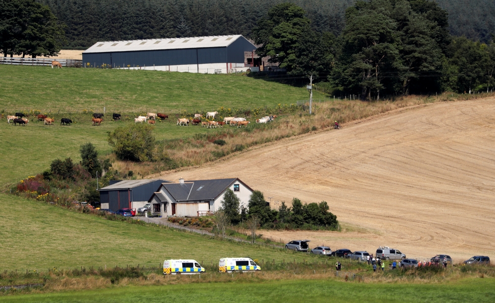 Emergency responders gather at the scene of a derailed passenger train near Stonehaven in Scotland, Britain, August 12, 2020. REUTERS/Russell Cheyne