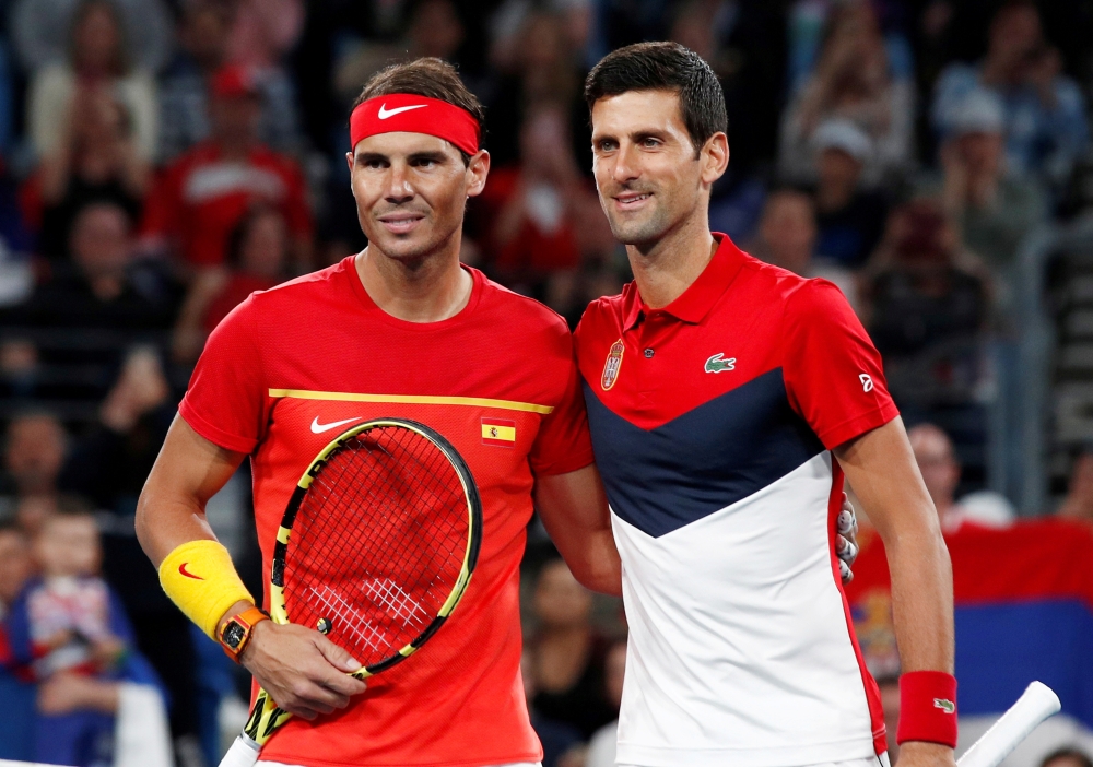 January 12, 2020 Spain's Rafael Nadal and Serbia's Novak Djokovic pose ahead of their Final singles match REUTERS/Edgar Su/File Photo