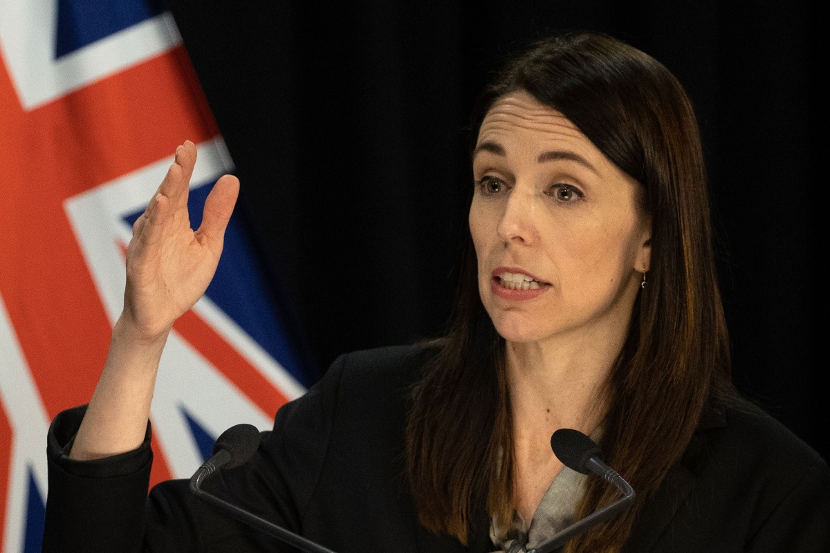 New Zealand's Prime Minister Jacinda Ardern speaks to the media regarding the latest case of COVID-19 coronavirus infections, breaking a 102-day run of no local transmissions, at the parliament in Auckland on August 12, 2020. / AFP / Marty MELVILLE