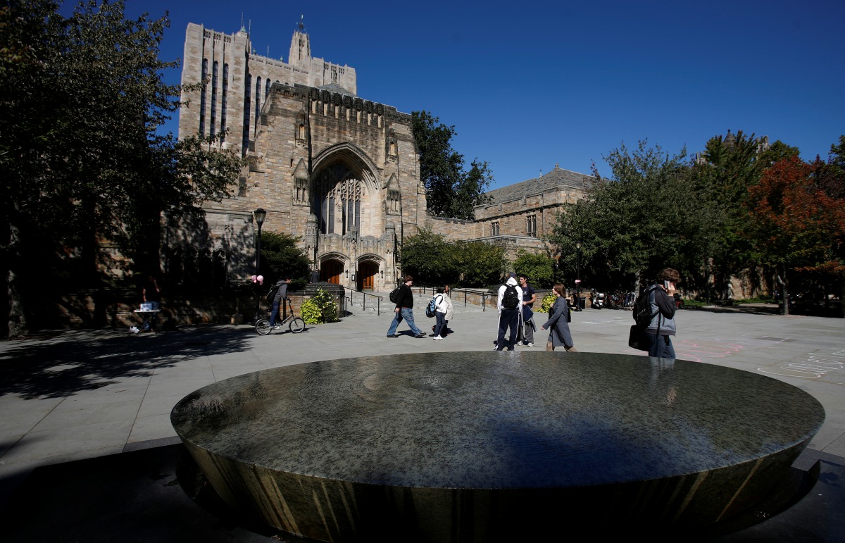 FILE PHOTO: Students walk on the campus of Yale University in New Haven, Connecticut, October 7, 2009. REUTERS/Shannon Stapleton/File Photo