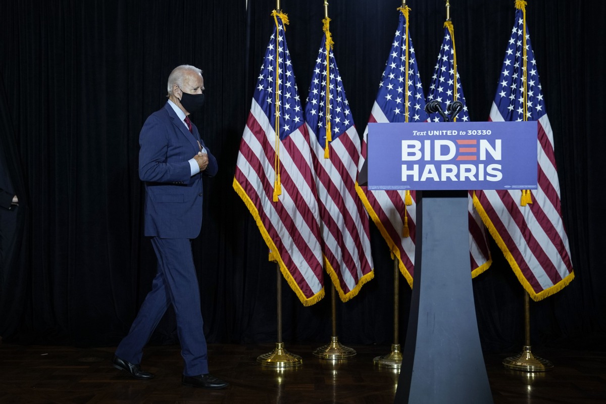 WILMINGTON, DE - AUGUST 13: Presumptive Democratic presidential nominee former Vice President Joe Biden arrives to deliver remarks following a coronavirus briefing with health experts at the Hotel DuPont on August 13, 2020 in Wilmington, Delaware.Drew Ang