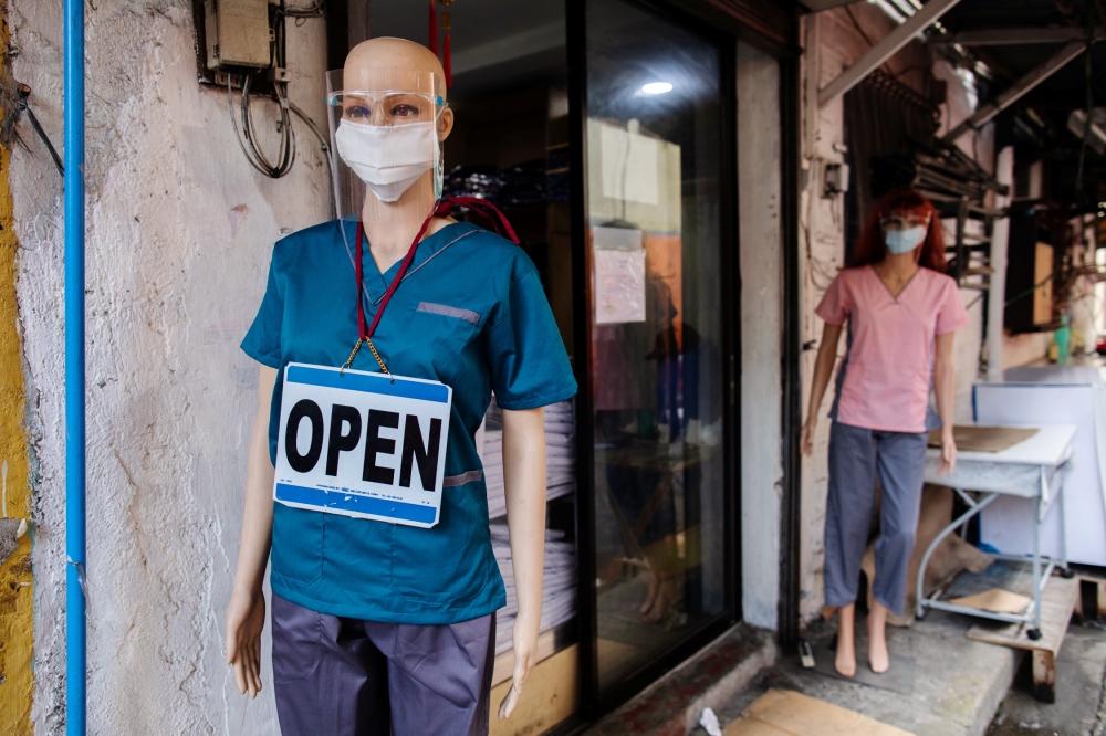 Mannequins wearing personal protective equipment are displayed outside a shop selling scrub suits, amid the coronavirus disease (COVID-19) outbreak, in Manila, Philippines August 10, 2020. REUTERS/Eloisa Lopez
