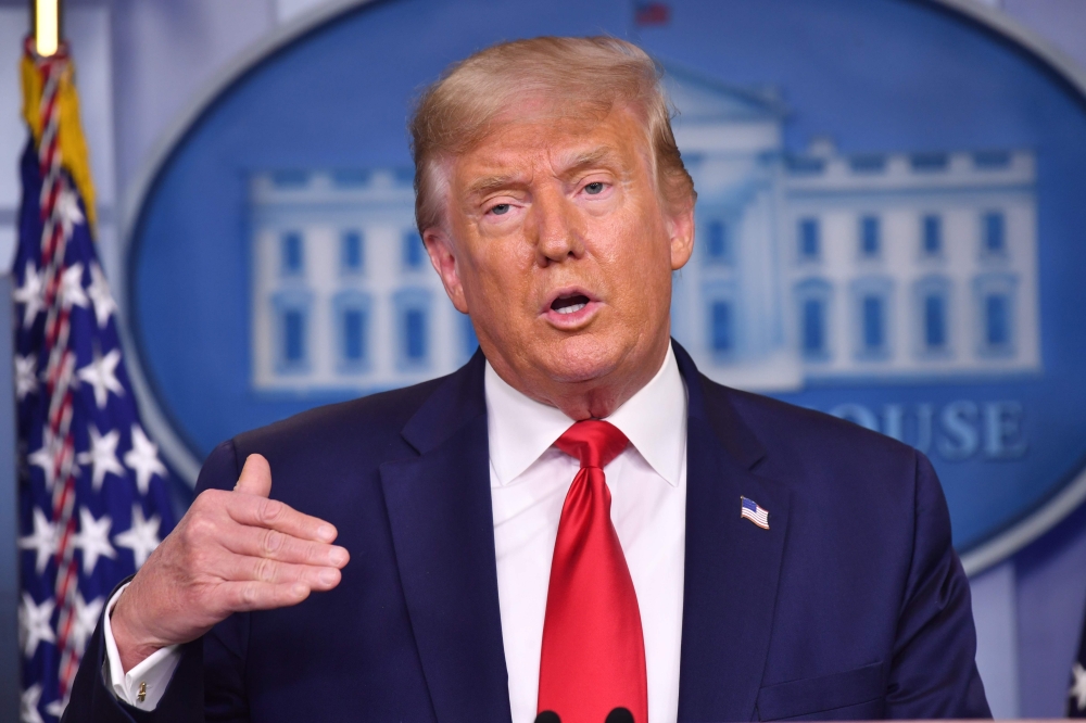 US President Donald Trump answers questions during a press conference in the Brady Briefing Room of the White House in Washington, DC, on August 14, 2020. / AFP / Nicholas Kamm