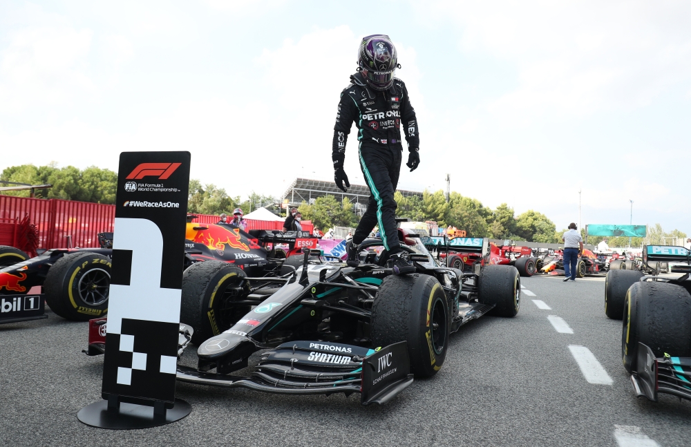 Formula One F1 - Spanish Grand Prix - Circuit de Barcelona-Catalunya, Barcelona, Spain - August 16, 2020 Mercedes' Lewis Hamilton gets out of the car after winning the race Pool via REUTERS/Albert Gea