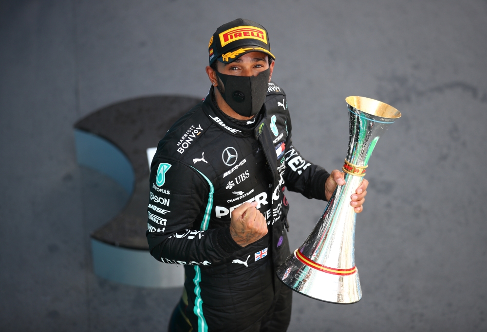 Formula One F1 - Spanish Grand Prix - Circuit de Barcelona-Catalunya, Barcelona, Spain - August 16, 2020 Winner Mercedes' Lewis Hamilton celebrates on the podium Pool via REUTERS/Bryn Lennon