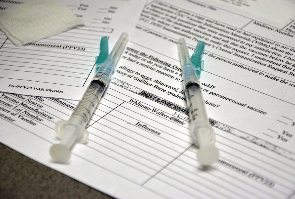 In this file photo taken on January 10, 2013, two syringes containing flu vaccine are ready at the Whitman-Walker Health Clinic in Washington, DC. Global influenza vaccine makers have produced a record number of doses for the coming flu season, as authori