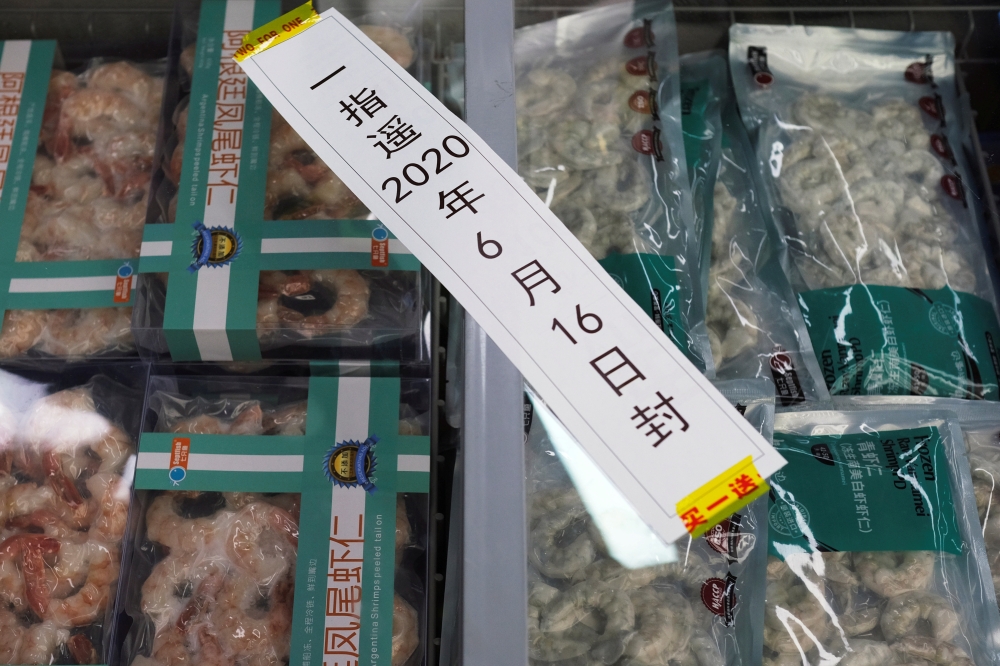 Frozen seafood products made of imported shrimps are seen inside a sealed freezer at a supermarket following a new outbreak of the coronavirus disease (COVID-19) in Beijing, China June 19, 2020. REUTERS/Carlos Garcia Rawlins/File Photo