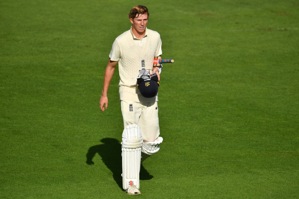England's Zak Crawley walks back to the pavilion after losing his wicket for 53 during play on the fifth day of the second Test cricket match between England and Pakistan at the Ageas Bowl in Southampton, southwest England on August 17, 2020. / AFP / POOL