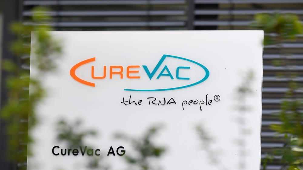 In this file photo taken on June 23, 2020 The logo of the biopharmaceutical company CureVac is seen in front of the company's headquarters in Tuebingen, southern Germany on June 23, 2020. / AFP / THOMAS KIENZLE
