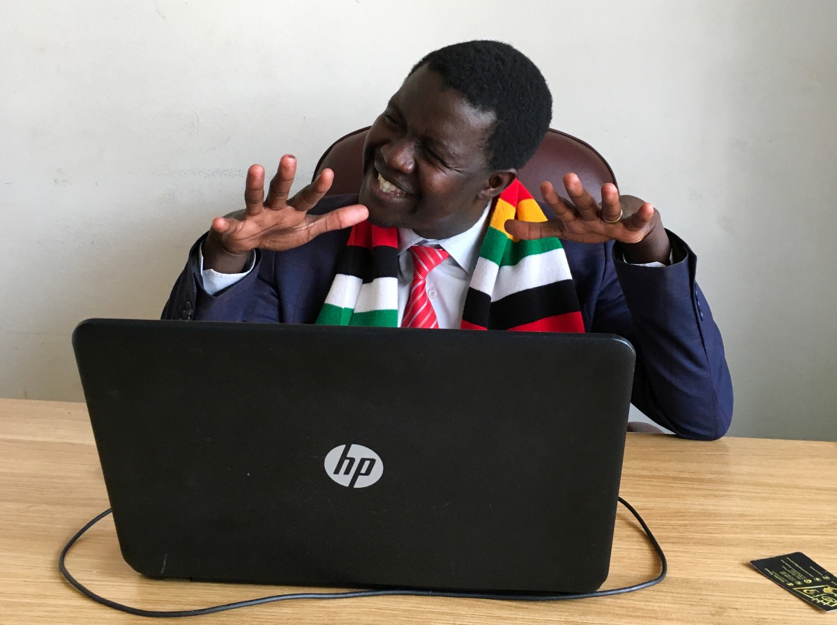 Zimbabwean comedian Victor Mpofu, aka Doc Vikela, discusses ideas for his next skit with staff at his office in Harare, Zimbabwe, August 20, 2020. REUTERS/MacDonald Dzirutwe/Staff
