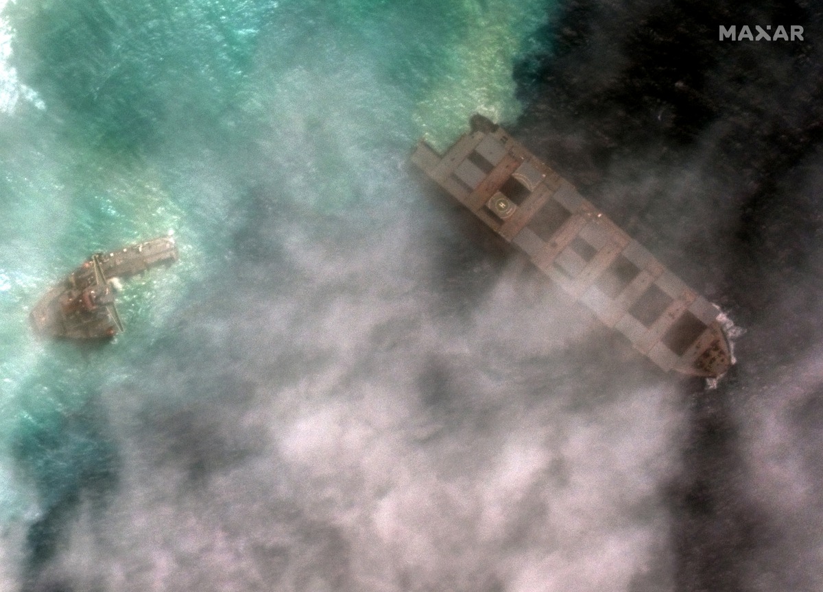 A satellite image shows the broken-up Japanese bulk carrier ship MV Wakashio, that ran aground on a reef last month causing an oil spill, off the coast of Pointe d'Esny, Mauritius August 15, 2020. Image taken August 15, 2020. Satellite image ©2020 Maxar T