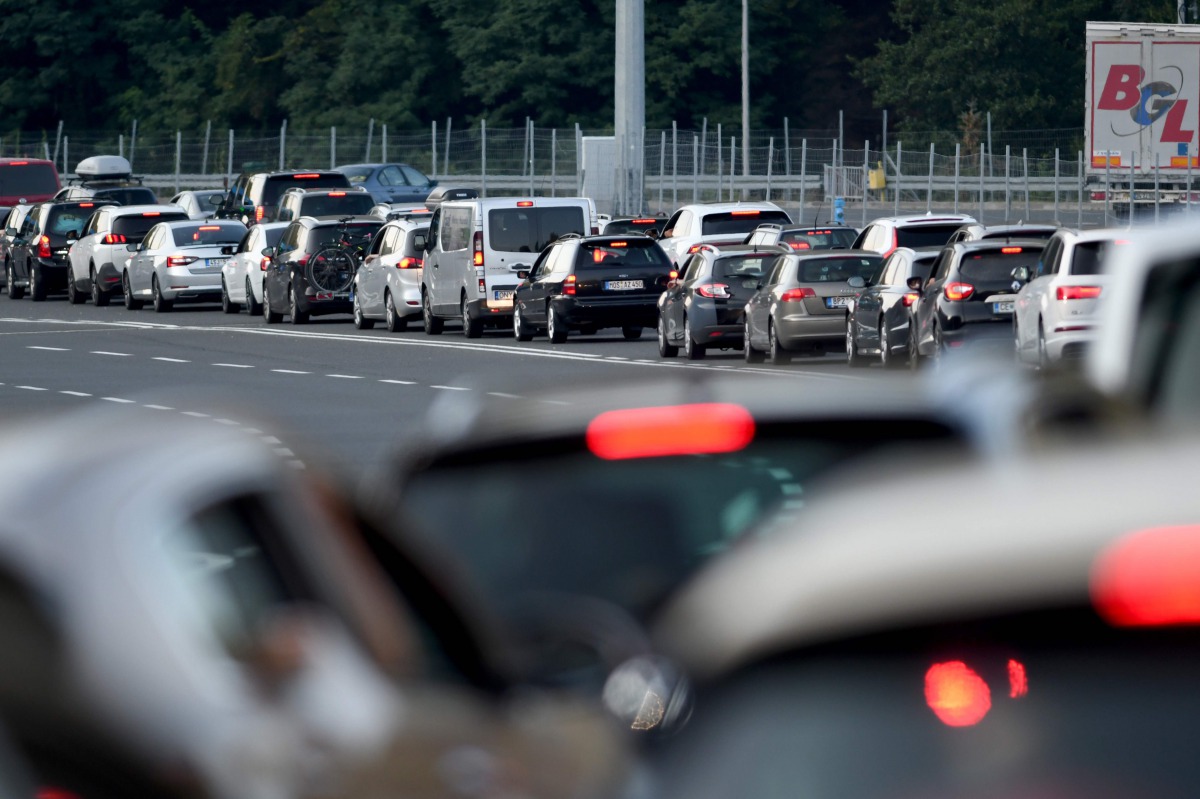 Vehicles, some from Austria, Slovenia and Germany, queue at the Macelj border crossing between Croatia and Slovenia, as many tourists take heed of a recommendation from their home country and leaving Croatia as the number of coronavirus infections rose to