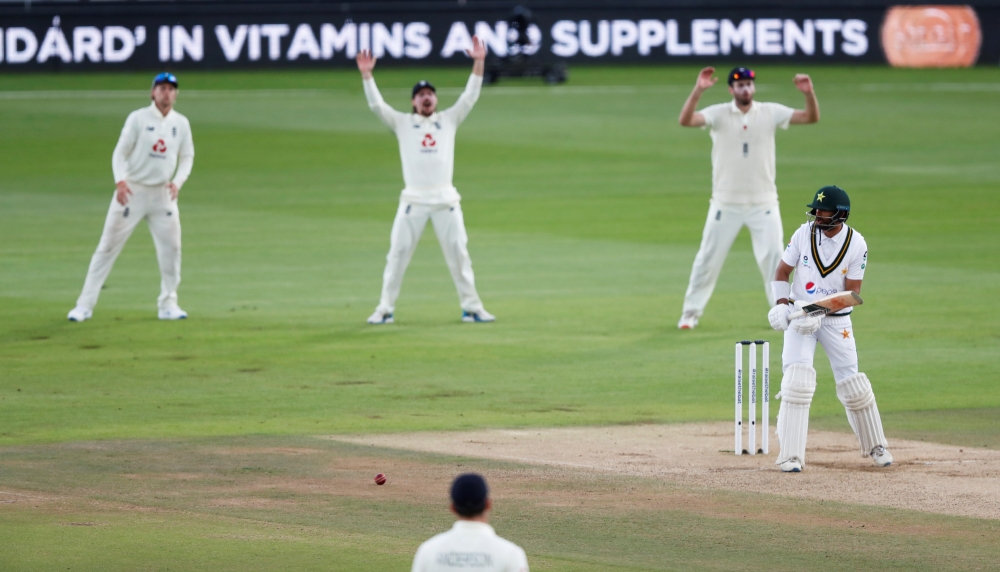 August 24, 2020 England's Rory Burns and teammates appeal unsuccessfully for the wicket of Pakistan's Shan Masood, as play resumes behind closed doors following the outbreak of the coronavirus disease (COVID-19) Alastair Grant/Pool via REUTERS