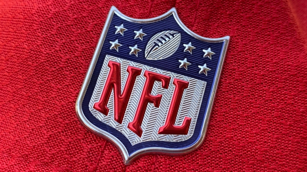 In this file photo taken on July 21, 2020 the official NFL logo is seen on the back of a hat in Los Angeles. A half-dozen NFL clubs experienced COVID-19 test result irregularities from the same New Jersey laboratory, prompting teams to change or cancel pr