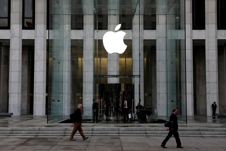 FILE PHOTO: The Apple Inc. logo is seen hanging at the entrance to the Apple store on 5th Avenue in Manhattan, New York, U.S., October 16, 2019. REUTERS/Mike Segar
