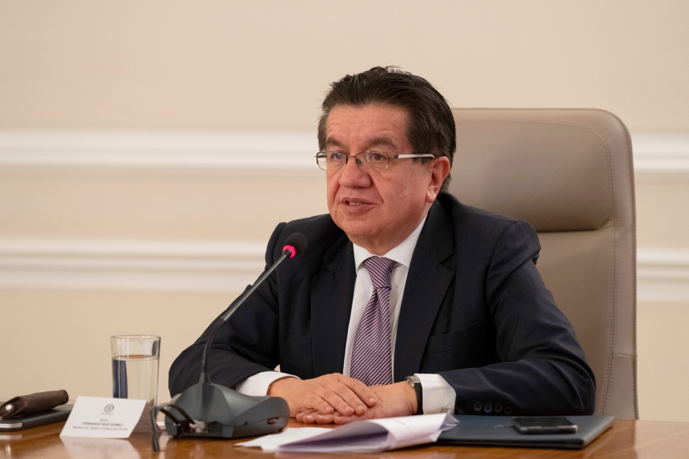 Colombian Minister of Health Fernando Ruiz speaks during the filming of the television program 