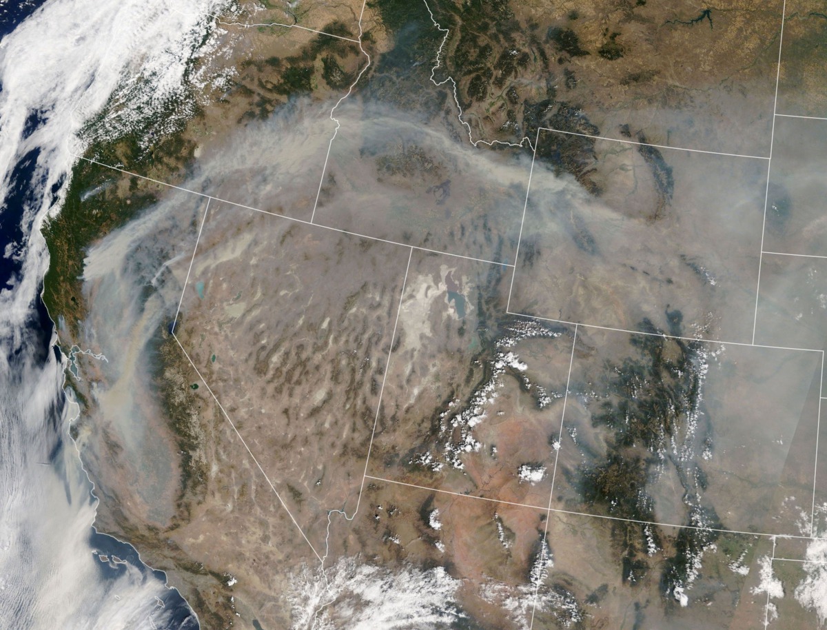 This NASA Earth Observatory image released on August 25, 2020 shows on August 21, 2020, what the Moderate Resolution Imaging Spectroradiometer on NASA’s Terra satellite captured in natural-color imagery of smoke plumes from wildfires in California and oth