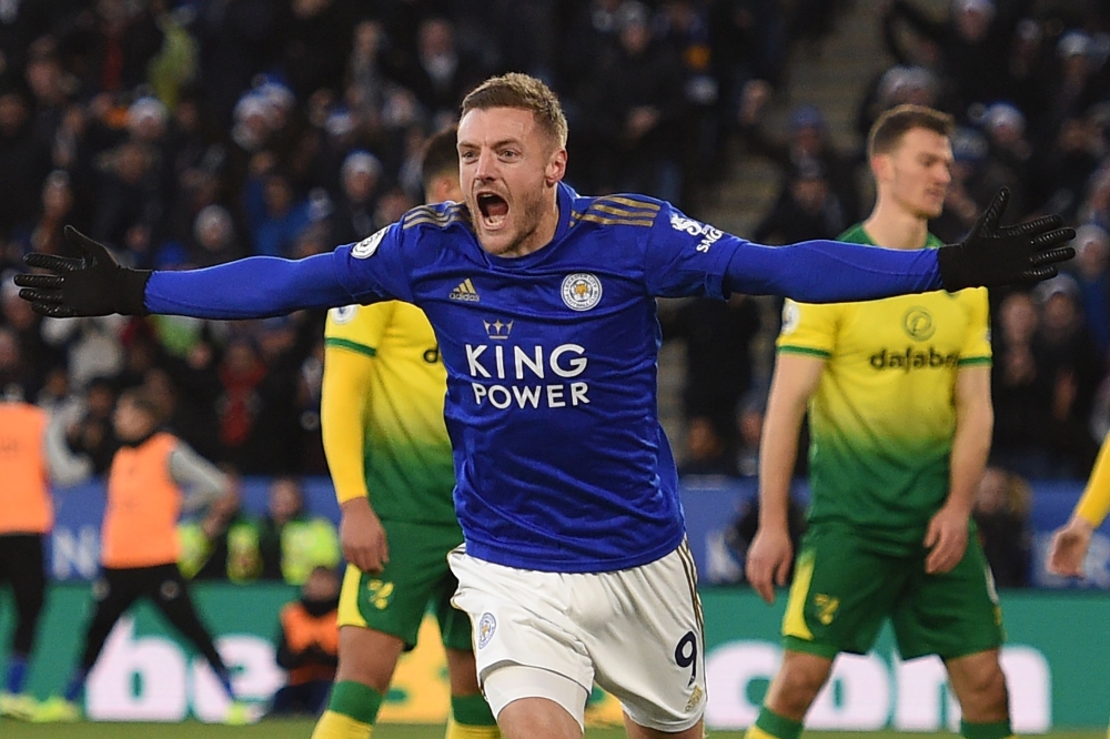 In this file photo taken on December 14, 2019 Leicester City's English striker Jamie Vardy celebrates after scoring their first goal during the English Premier League football match between Leicester City and Norwich City at King Power Stadium in Leiceste