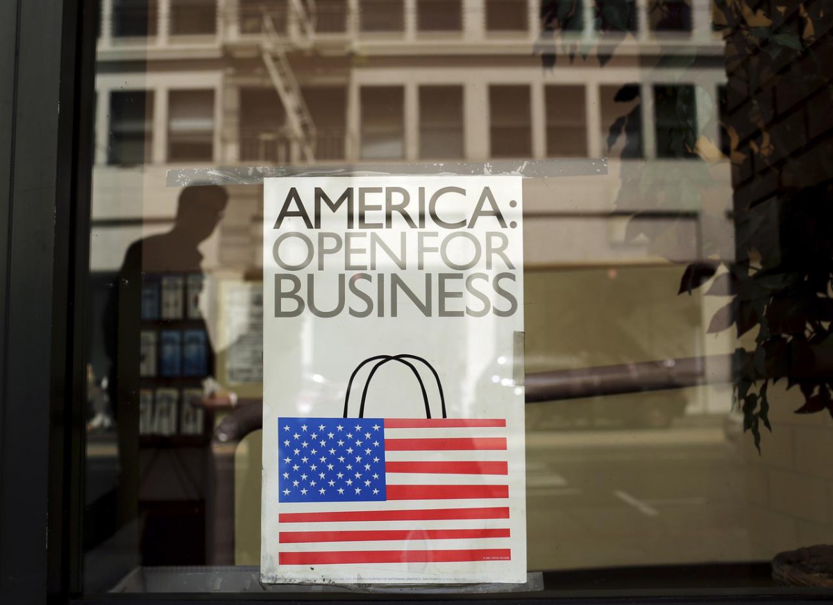 FILE PHOTO: A sign is shown in the window of a retail store in San Francisco, California May 13, 2013. REUTERS/Robert Galbraith
