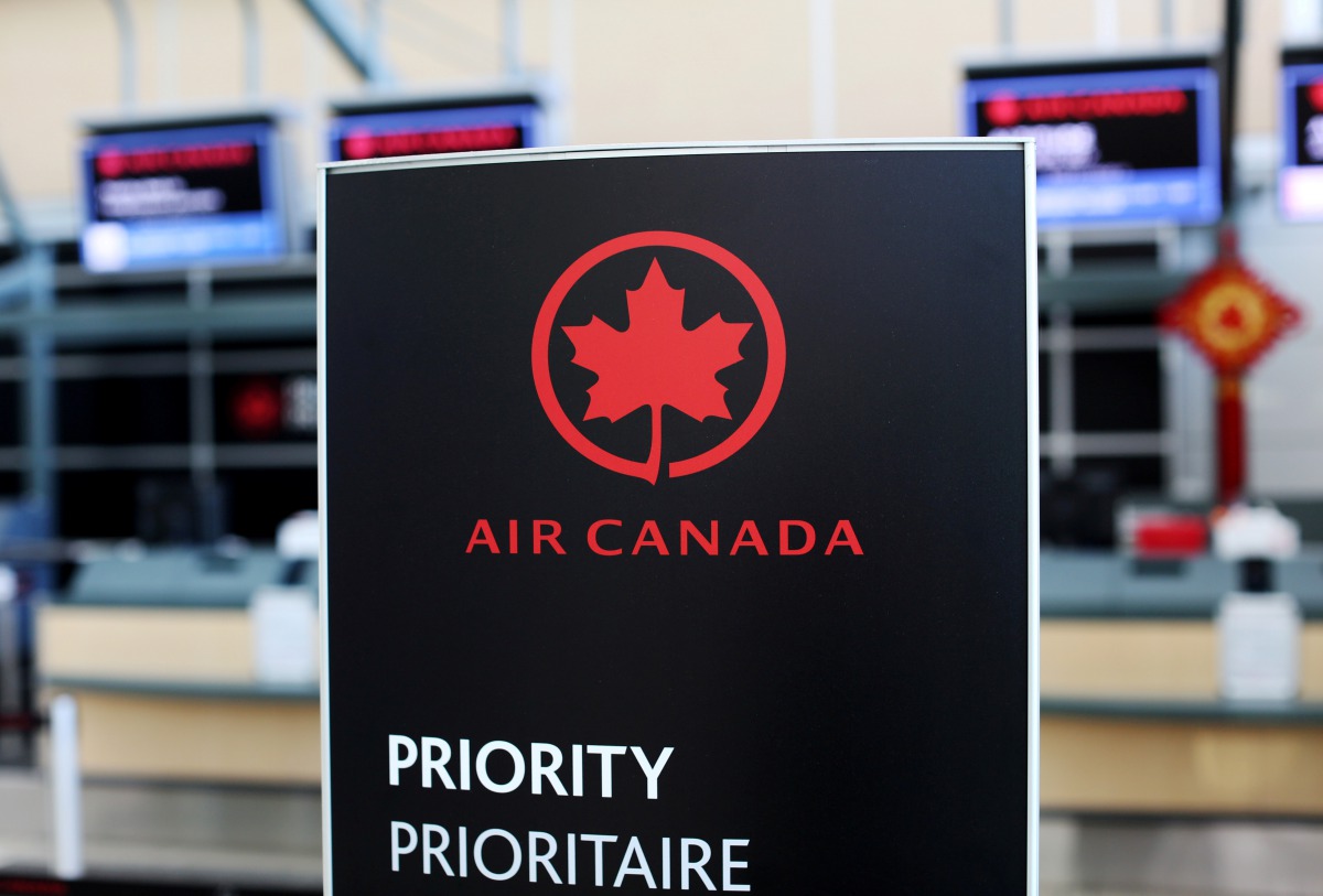 FILE PHOTO: Air Canada signage is pictured at Vancouver's international airport in Richmond, British Columbia, Canada, February 5, 2019. REUTERS/Ben Nelms/File Photo
