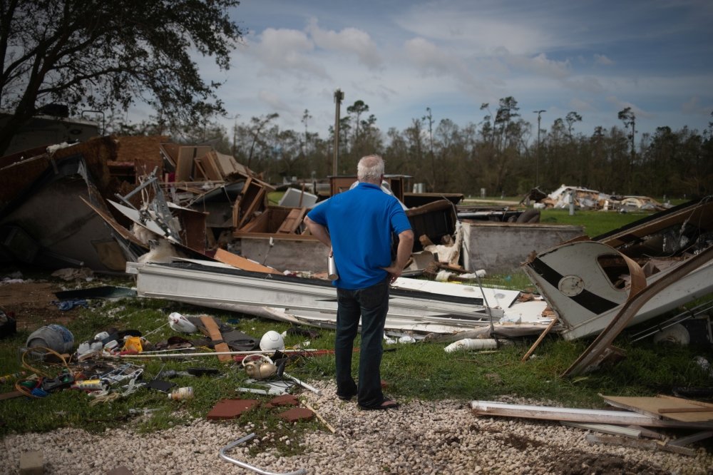 Lonnie Gatte returns to find his destroyed residence in the aftermath of Hurricane Laura in Sulphur, Louisiana, U.S., August 27, 2020. REUTERS/Adrees Latif