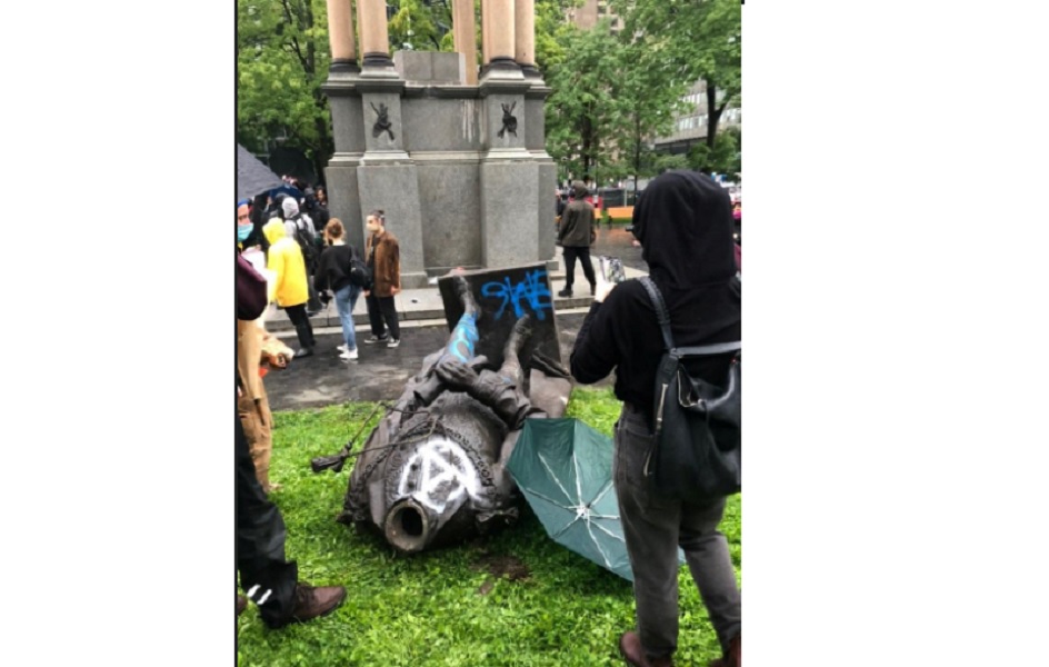 Statue of John MacDonald is seen on the ground after it was pulled down during a protest against racial inequality, in Montreal, Quebec, Canada August 29, 2020 in this picture obtained from social media. Instagram - @andelinaht/via REUTERS
