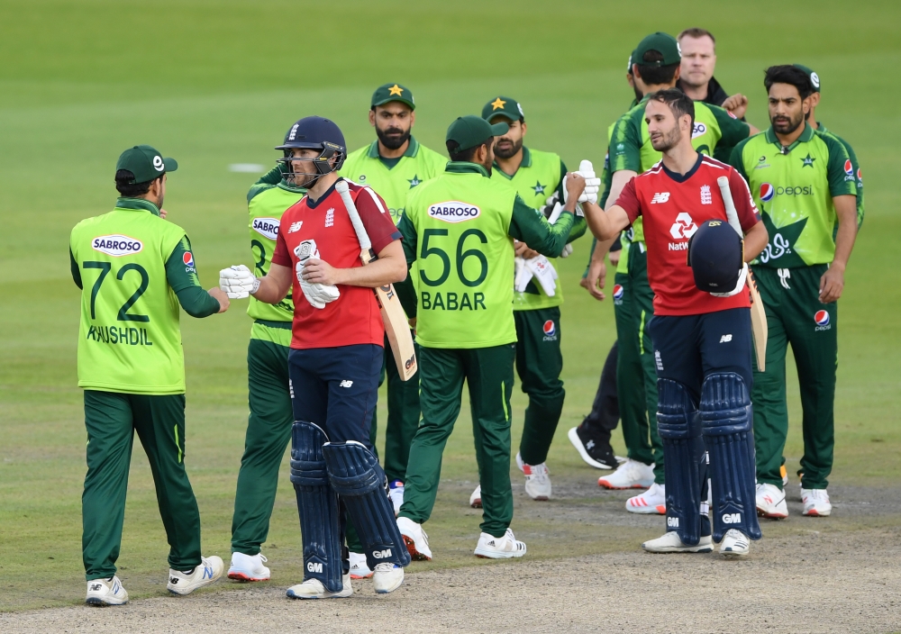 Second T20 International - England v Pakistan - Emirates Old Trafford, Manchester, Britain - August 30, 2020 England's Dawid Malan and Lewis Gregory shake hands with Pakistan players after the match Mike Hewitt/Pool via REUTERS

