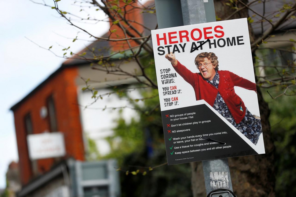FILE PHOTO: A public health information advert is seen on a lampost as the spread of the coronavirus disease (COVID-19) continues, Dublin, Republic of Ireland, April 21, 2020 REUTERS/Jason Cairnduff
