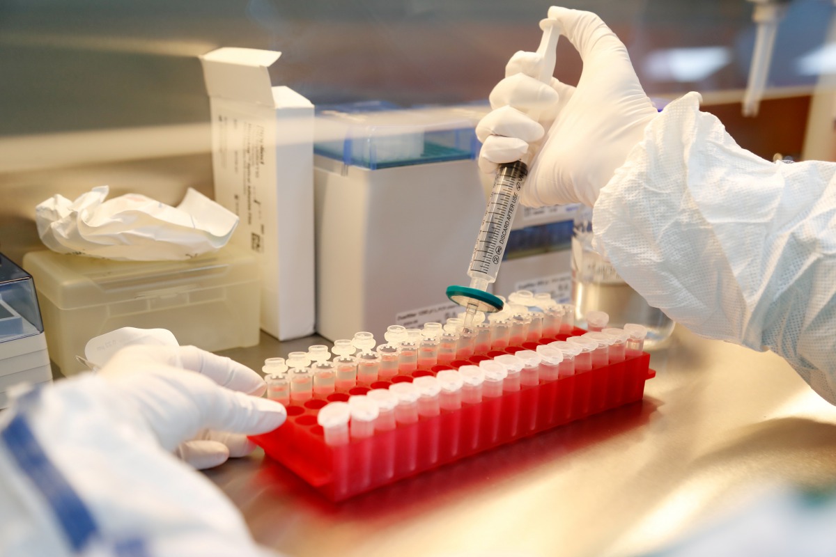 FILE PHOTO: A scientist filters out samples during the research and development of a vaccine against the coronavirus disease (COVID-19) at a laboratory of BIOCAD biotechnology company in St Petersburg, Russia June 11, 2020. REUTERS/Anton Vaganov/File Phot