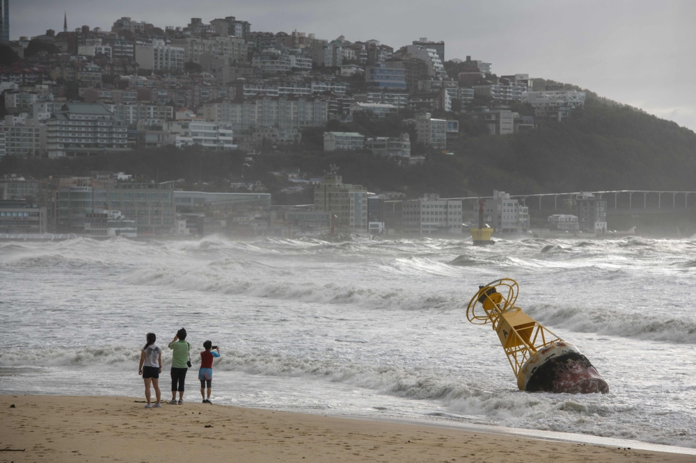 A general view shows a buoy that was un-tethered during heavy swell brought by Typhoon Maysak overnight on Haeundae beach in Busan on September 3, 2020. / AFP / Ed JONES